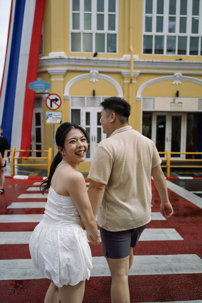 Phuket engagement photographer capturing romantic couple photoshoot in Phuket Old Town Thailand with colorful streets and urban architecture