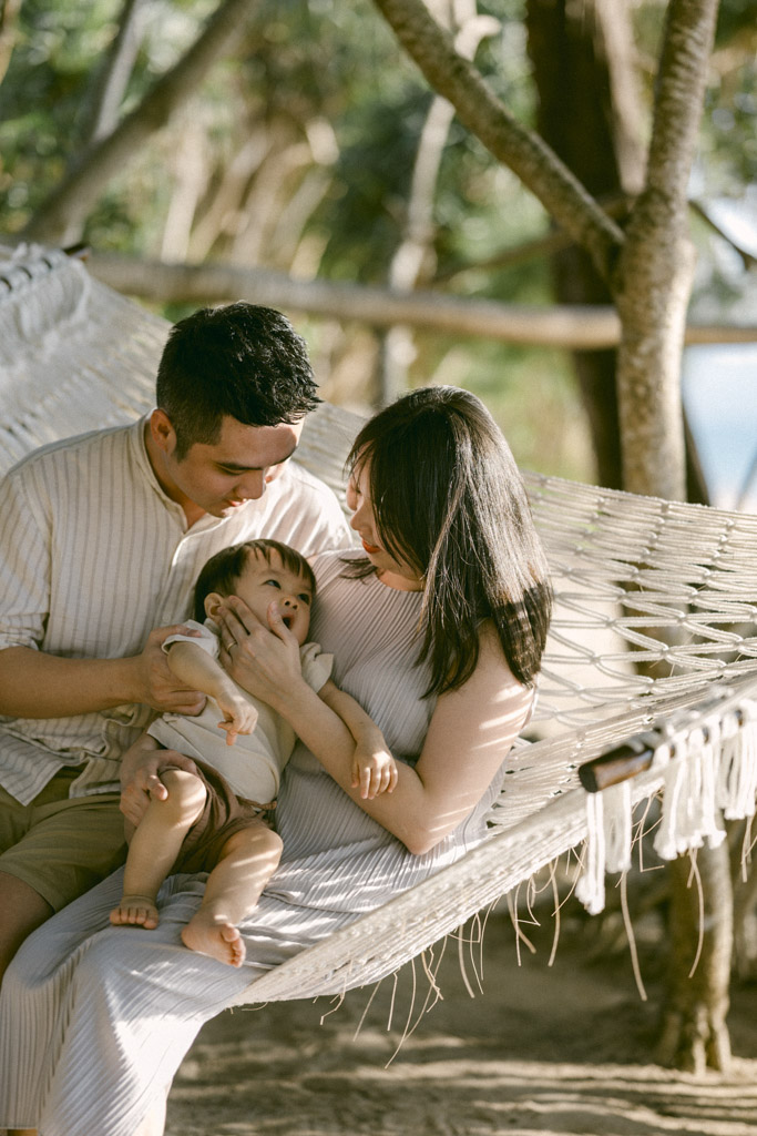 Phuket family photographer capturing natural sunset beach family photoshoot in Phuket Thailand